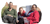 3 individuals sat outside smiling for the camera